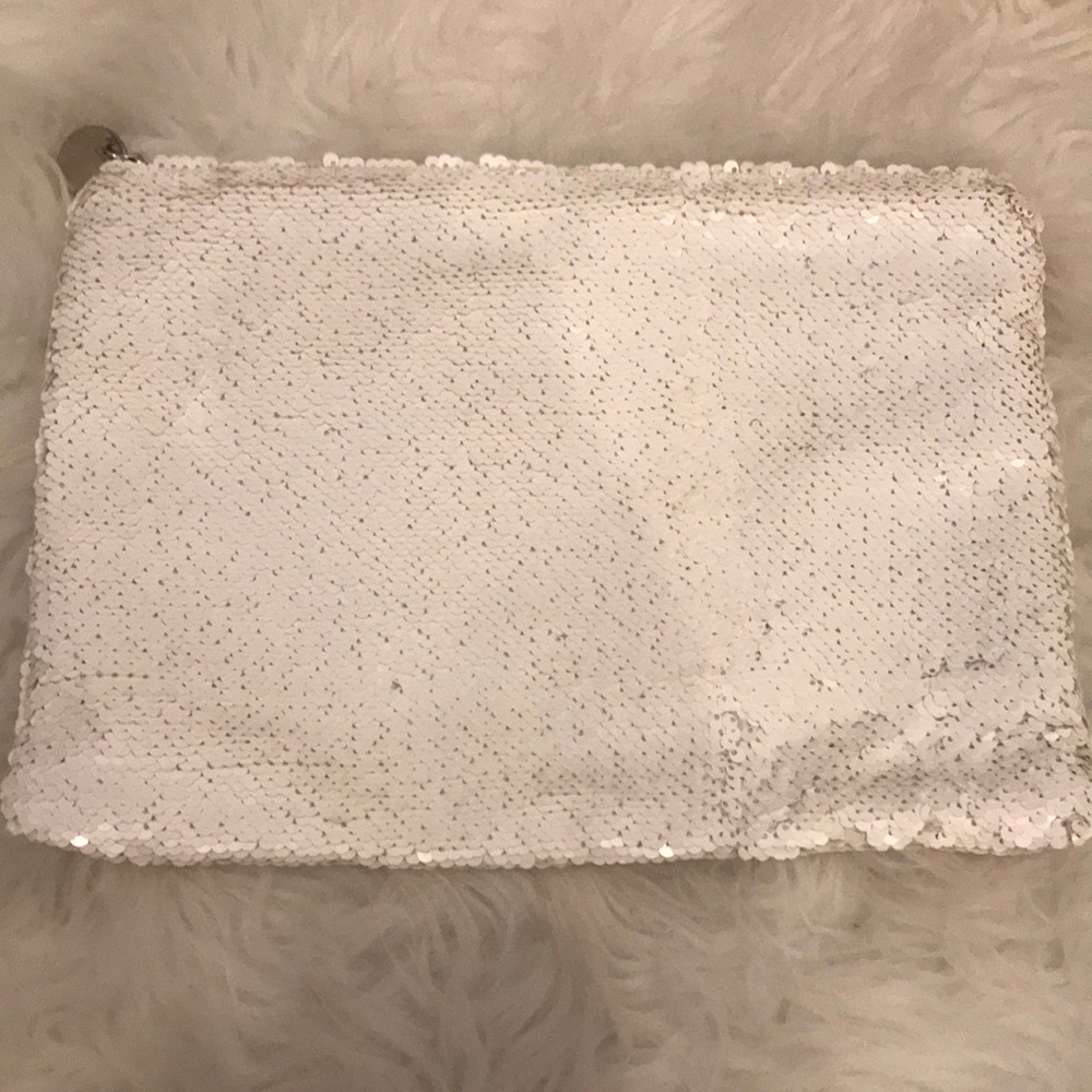 The limited white sequin zip clutch